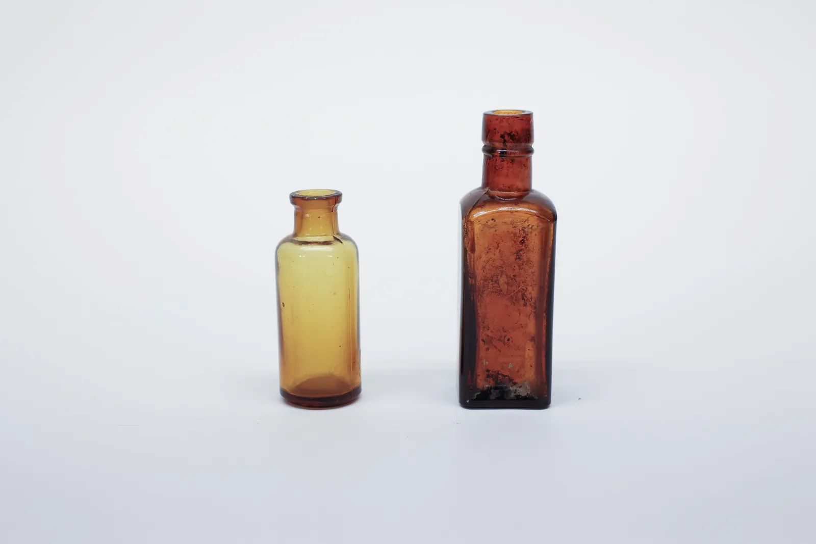 Pair of Antique Amber Glass Apothecary Bottles